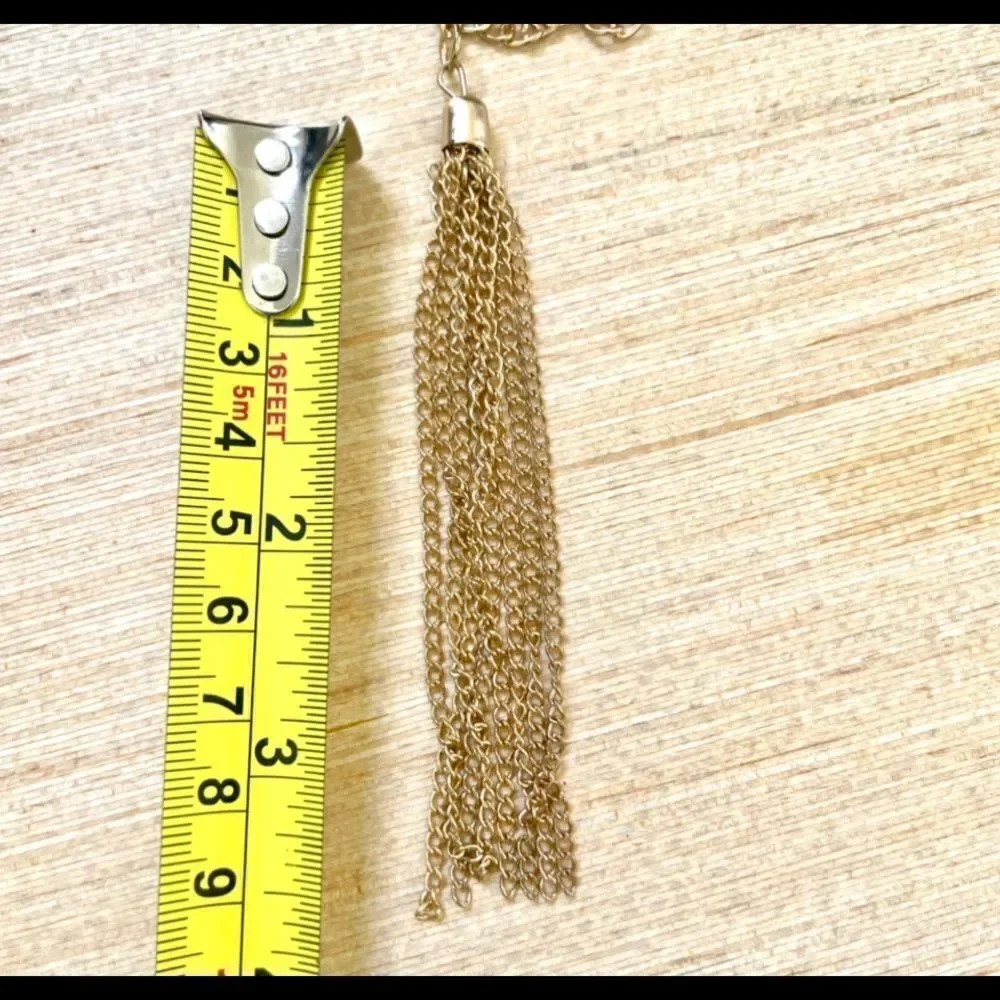 Gold tone long tassel necklace